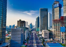 pexels-photo-2116721-2116721 Stunning aerial view of Jakarta's modern skyline with bustling streets below.